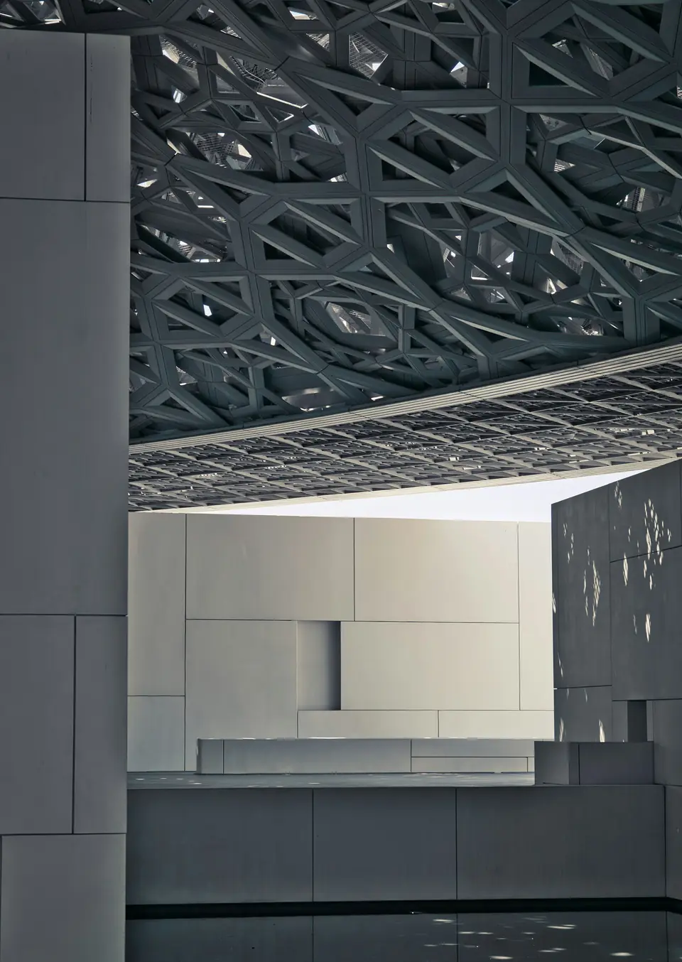 Real architectural photograph of the outdoor space at Louvre Abu Dhabi.